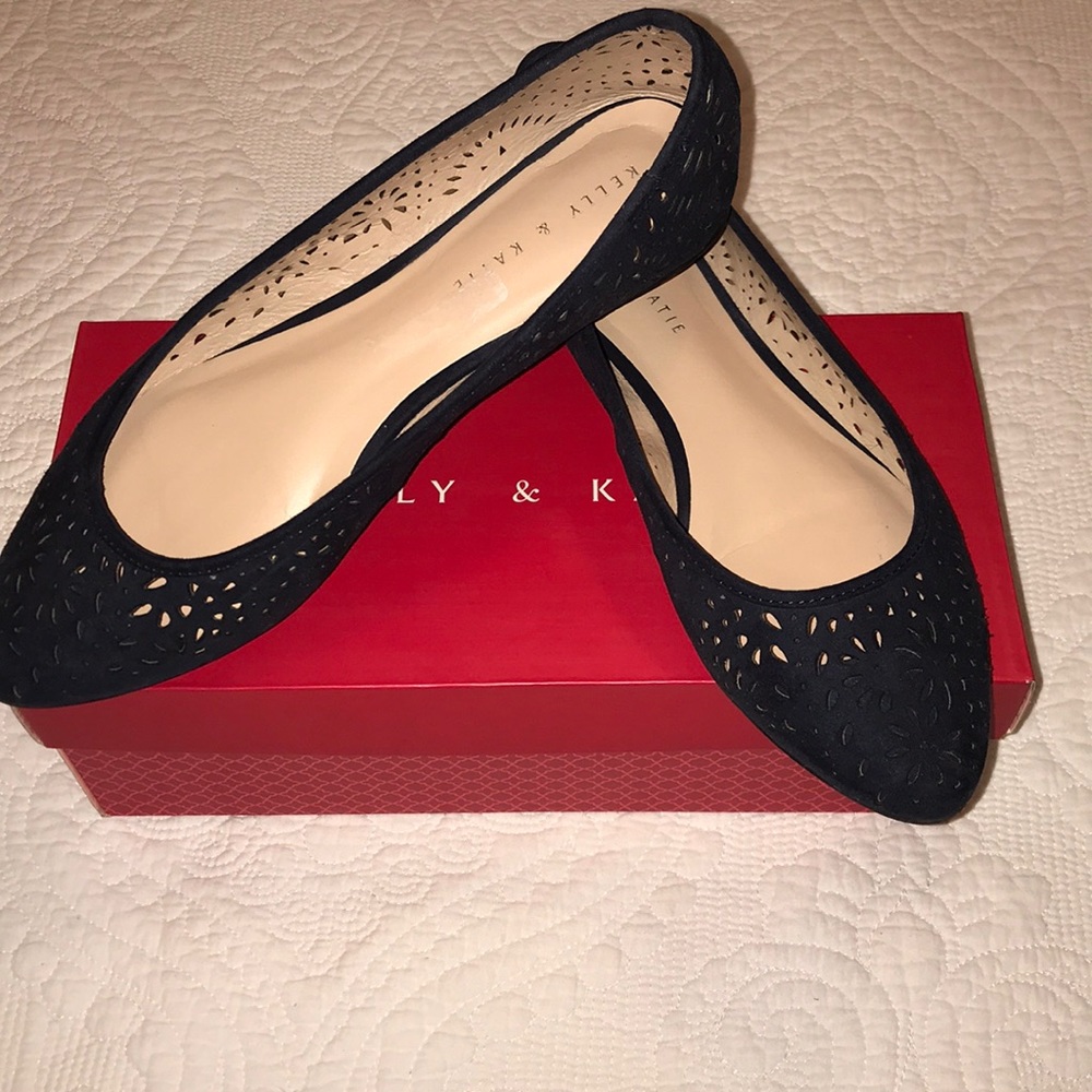 Laser-cut navy ballerina shoes.